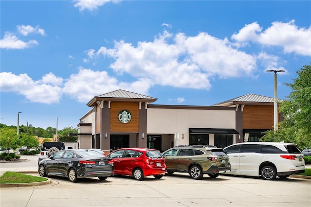 1466 Arena Rd, Fleming Island, FL 32003 - view of building exterior featuring uncovered parking