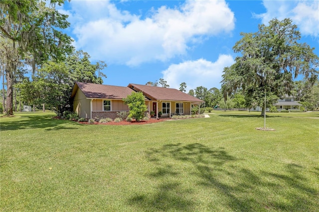 1466 Arena Rd, Fleming Island, FL 32003 - rear view of house featuring a lawn