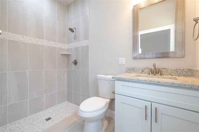 47 Providence Ln, Palm Coast, FL 32164 - bathroom featuring toilet, a tile shower, and vanity