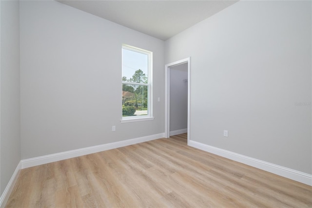 47 Providence Ln, Palm Coast, FL 32164 - empty room featuring light wood-style floors and baseboards