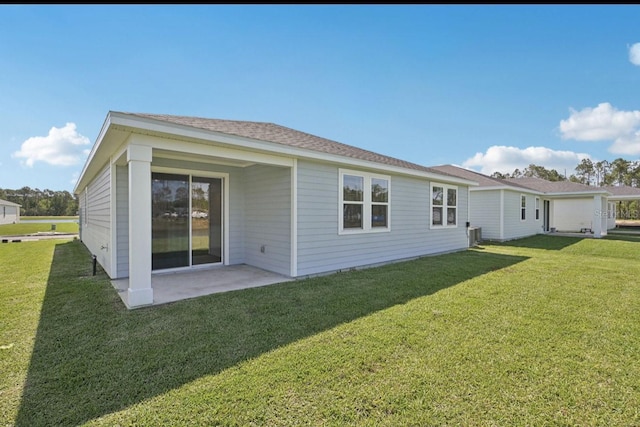 9 Wandering Crk, Way, Palm Coast, FL 32164 - back of property with a lawn, a patio, and cooling unit