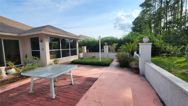 7 Wayman Pl, Palm Coast, FL 32164 - view of patio with a sunroom