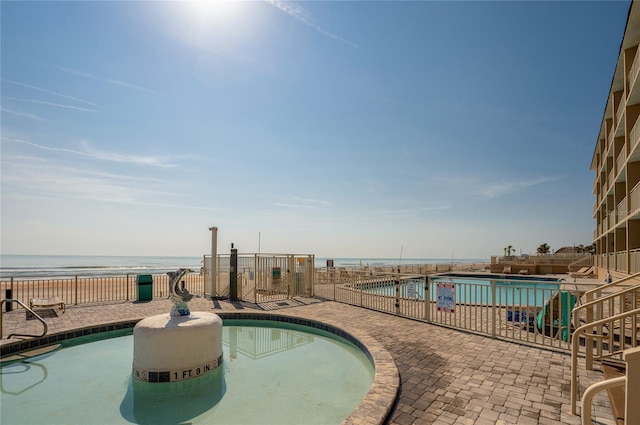 219 S Atlantic Ave Unit 204, Daytona Beach, FL 32118 - community pool featuring a patio and a water view