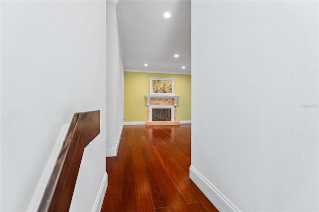 8 Oakmont Ct Unit 0, Palm Coast, FL 32137 - hallway with recessed lighting, ornamental molding, baseboards, and dark wood-type flooring