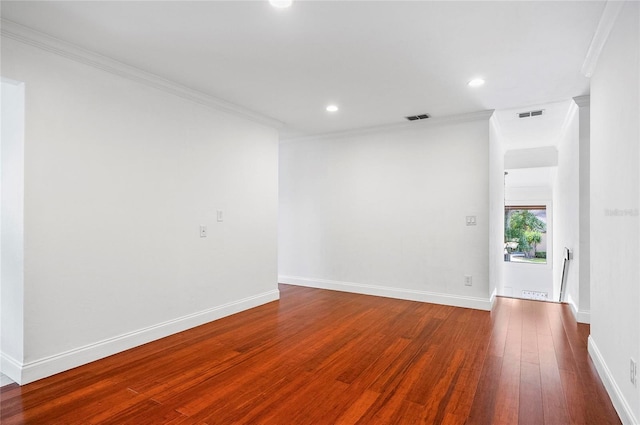 8 Oakmont Ct Unit 0, Palm Coast, FL 32137 - empty room featuring wood finished floors, ornamental molding, recessed lighting, and baseboards