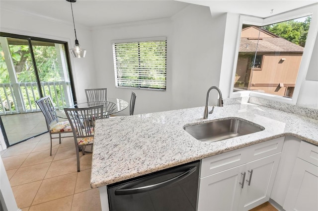 8 Oakmont Ct Unit 0, Palm Coast, FL 32137 - kitchen featuring dishwashing machine, a sink, light tile patterned flooring, white cabinets, and pendant lighting