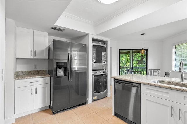 8 Oakmont Ct Unit 0, Palm Coast, FL 32137 - kitchen featuring appliances with stainless steel finishes, stacked washer and clothes dryer, a sink, light tile patterned floors, and white cabinetry