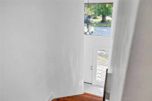 8 Oakmont Ct Unit 0, Palm Coast, FL 32137 - stairs with a chandelier and wood finished floors