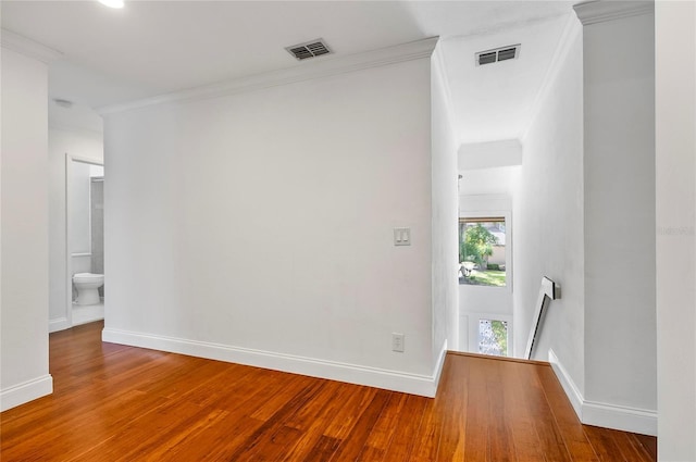 8 Oakmont Ct Unit 0, Palm Coast, FL 32137 - unfurnished room with wood finished floors, baseboards, and crown molding