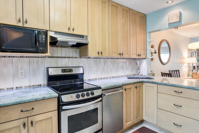 8550 A1A S Unit 323, Saint Augustine, FL 32080 - kitchen featuring stainless steel appliances, under cabinet range hood, a sink, decorative backsplash, and light stone counters