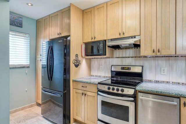 8550 A1A S Unit 323, Saint Augustine, FL 32080 - kitchen with black appliances, under cabinet range hood, light brown cabinetry, baseboards, and recessed lighting