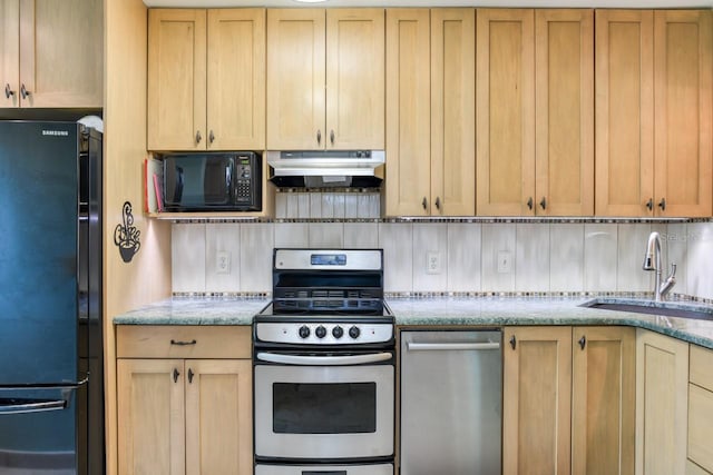 8550 A1A S Unit 323, Saint Augustine, FL 32080 - kitchen featuring black appliances, under cabinet range hood, a sink, decorative backsplash, and light stone countertops