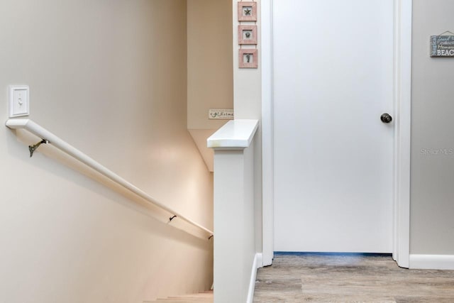 8550 A1A S Unit 323, Saint Augustine, FL 32080 - stairway with wood finished floors and baseboards