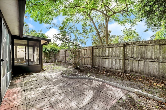 503 Kettering Way, Orange Park, FL 32073 - fenced backyard with a patio area and a sunroom