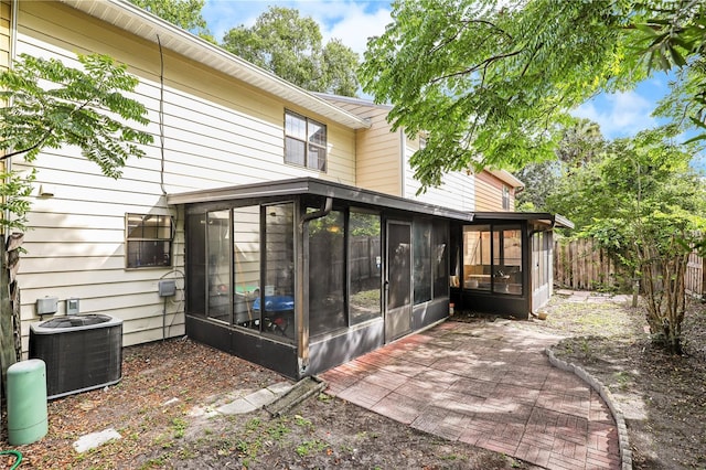 503 Kettering Way, Orange Park, FL 32073 - back of property featuring a sunroom and central AC unit