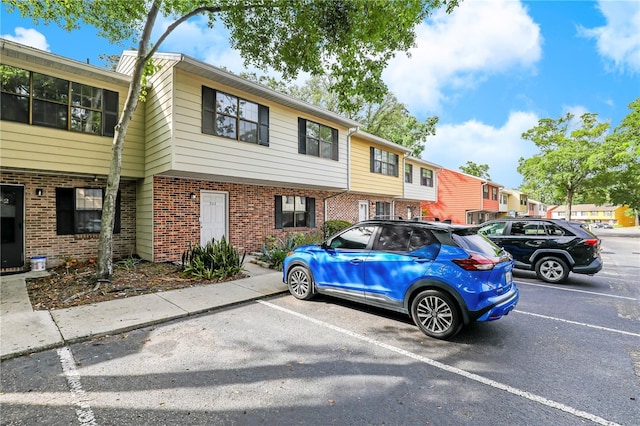 503 Kettering Way, Orange Park, FL 32073 - view of front facade featuring brick siding and uncovered parking