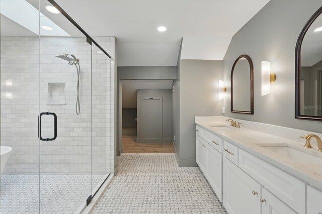 3 Cole Pl, Palm Coast, FL 32137 - bathroom featuring double vanity, a shower stall, recessed lighting, tile patterned floors, and baseboards