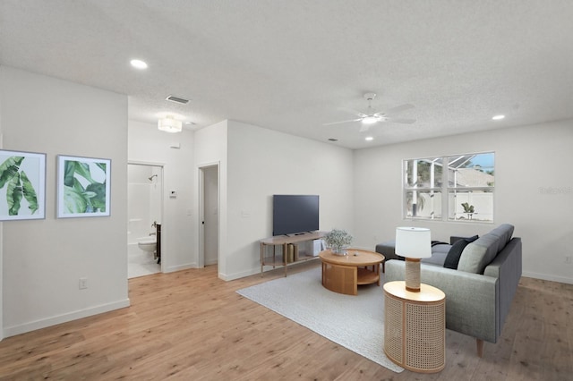 40 Pinetree Dr, Palm Coast, FL 32164 - living room featuring a ceiling fan, light wood finished floors, recessed lighting, and baseboards