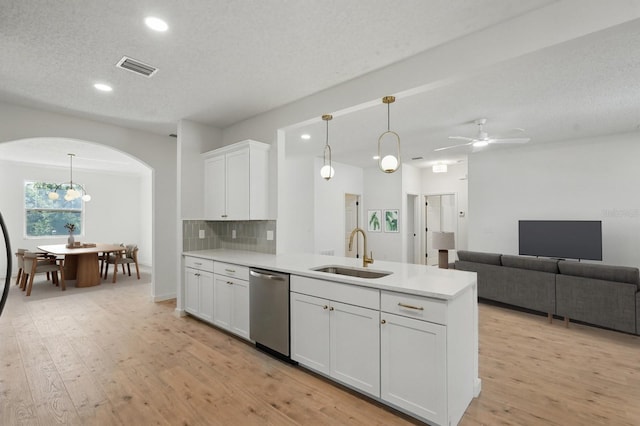 40 Pinetree Dr, Palm Coast, FL 32164 - kitchen with a sink, dishwasher, arched walkways, light countertops, and ceiling fan