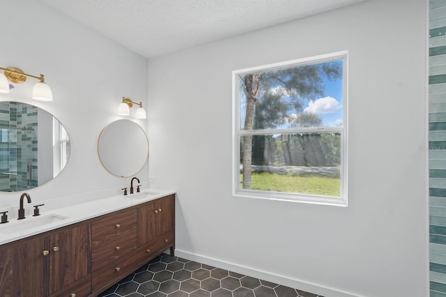 40 Pinetree Dr, Palm Coast, FL 32164 - full bath featuring double vanity, tile patterned floors, tiled shower, and baseboards