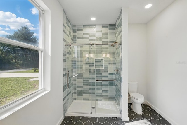 40 Pinetree Dr, Palm Coast, FL 32164 - bathroom with toilet, a stall shower, recessed lighting, tile patterned floors, and baseboards