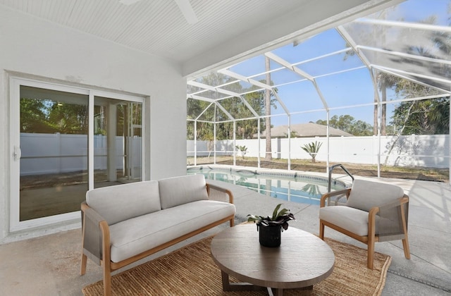 40 Pinetree Dr, Palm Coast, FL 32164 - fenced backyard featuring a patio area, an outdoor living space, and glass enclosure