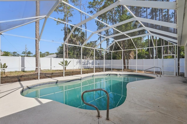 40 Pinetree Dr, Palm Coast, FL 32164 - view of swimming pool with a fenced backyard, a patio area, and glass enclosure