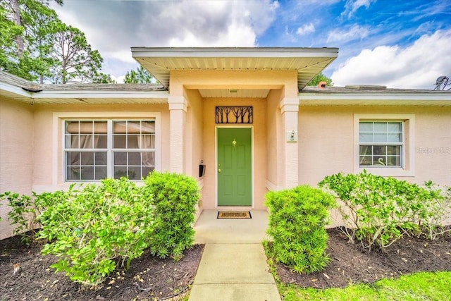 19 Utica Path, Palm Coast, FL 32164 - view of exterior entry featuring stucco siding