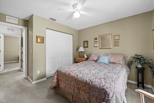 19 Utica Path, Palm Coast, FL 32164 - bedroom featuring carpet floors, a closet, baseboards, a textured ceiling, and a ceiling fan