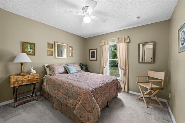 19 Utica Path, Palm Coast, FL 32164 - bedroom featuring light colored carpet, a textured ceiling, a ceiling fan, and baseboards