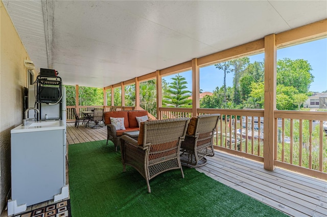 4 Contee Ct, Palm Coast, FL 32137 - wooden deck with outdoor dining area, a sink, and an outdoor living space