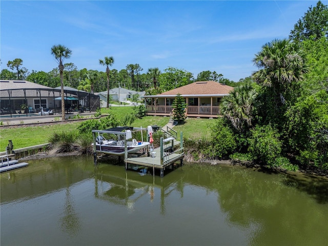 4 Contee Ct, Palm Coast, FL 32137 - dock featuring a lawn and a deck with water view