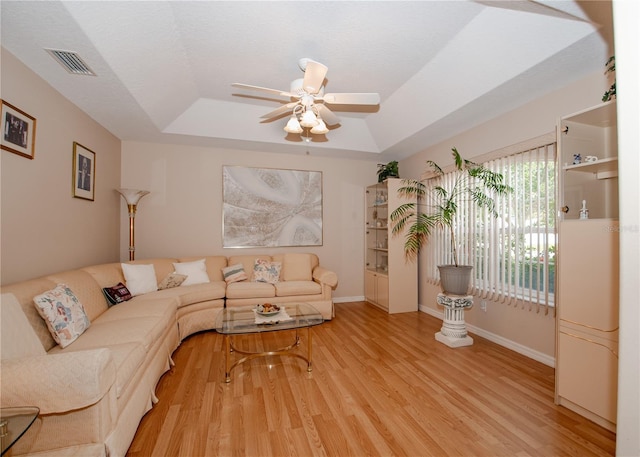1 Butternut Dr, Palm Coast, FL 32137 - living area with a tray ceiling, a ceiling fan, light wood finished floors, and baseboards