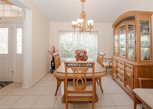1 Butternut Dr, Palm Coast, FL 32137 - dining space with a chandelier, light tile patterned flooring, decorative columns, and baseboards