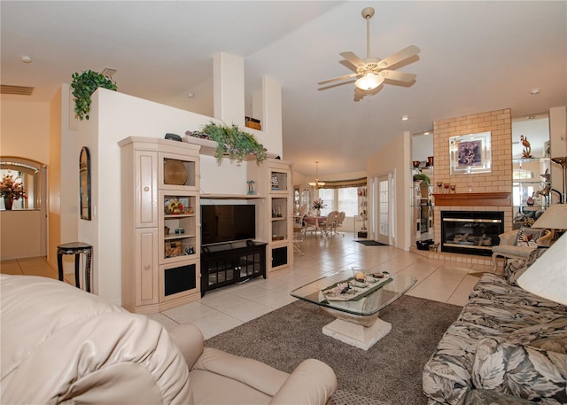 1 Butternut Dr, Palm Coast, FL 32137 - living room featuring light tile patterned flooring, ceiling fan, a fireplace, and high vaulted ceiling
