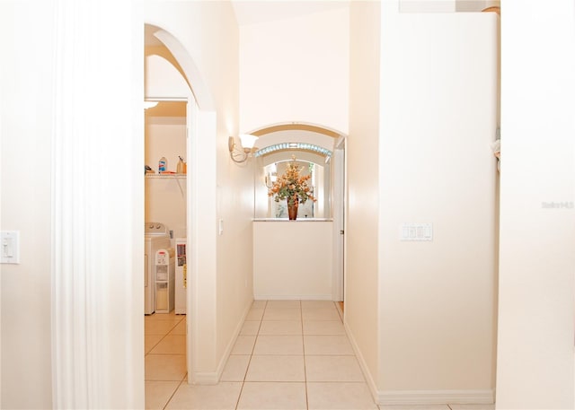 1 Butternut Dr, Palm Coast, FL 32137 - corridor with light tile patterned floors, washer and dryer, and baseboards