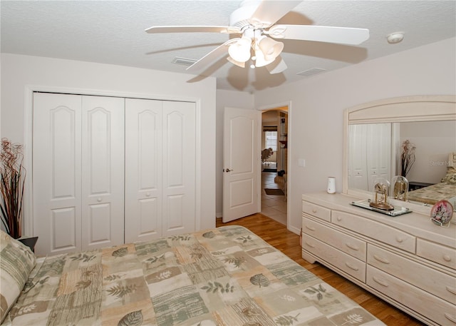 1 Butternut Dr, Palm Coast, FL 32137 - bedroom featuring wood finished floors, ceiling fan, a closet, and baseboards