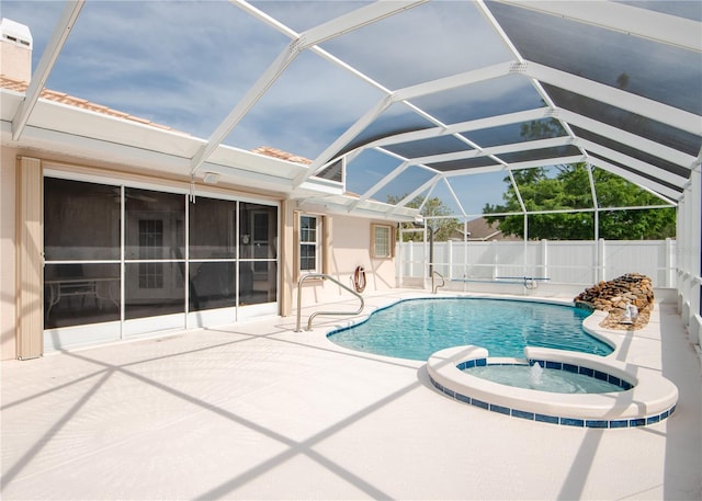 1 Butternut Dr, Palm Coast, FL 32137 - view of swimming pool with a patio area, a pool with connected hot tub, and glass enclosure