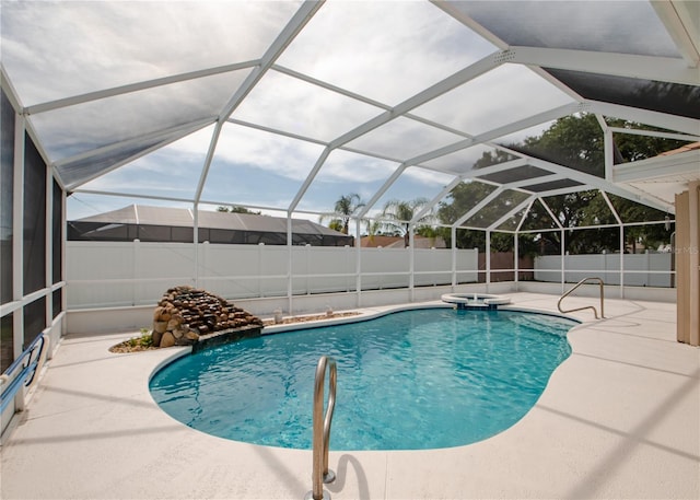 1 Butternut Dr, Palm Coast, FL 32137 - view of swimming pool with a fenced backyard, a patio area, and a pool with connected hot tub