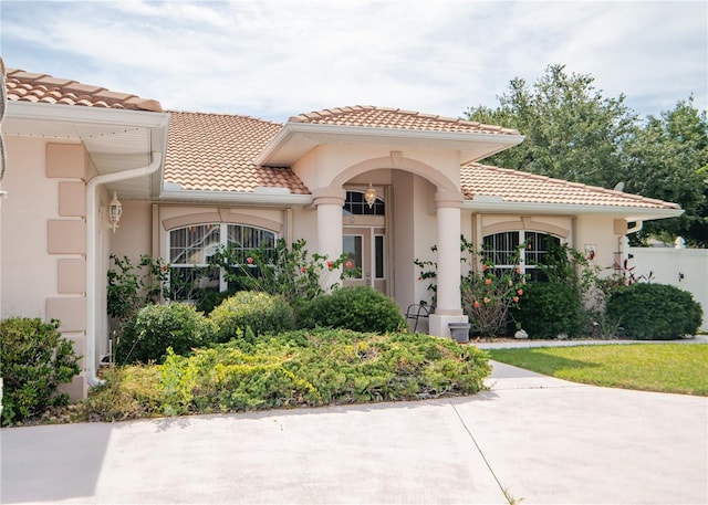 1 Butternut Dr, Palm Coast, FL 32137 - view of front of property with a tile roof and stucco siding