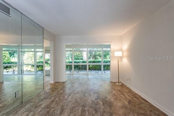 9 Masters Ct, Palm Coast, FL 32137 - spare room with baseboards