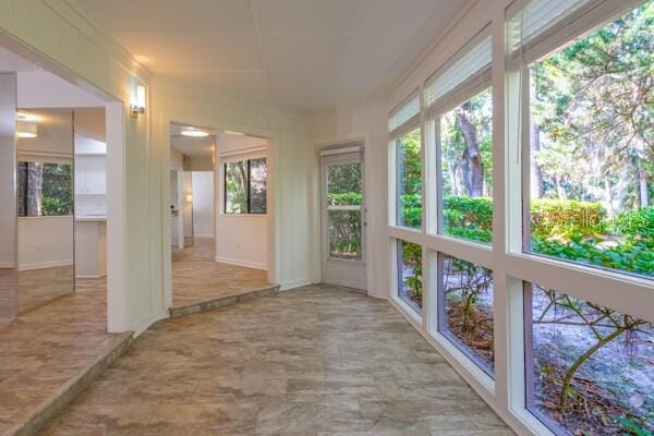 9 Masters Ct, Palm Coast, FL 32137 - unfurnished sunroom featuring healthy amount of natural light