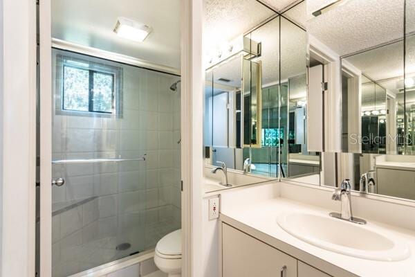 9 Masters Ct, Palm Coast, FL 32137 - full bath with a stall shower, toilet, and vanity