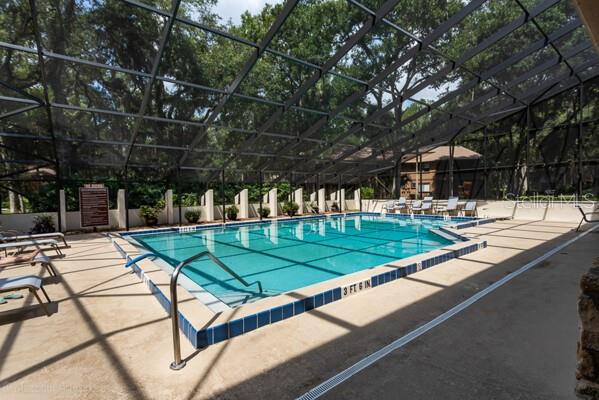 9 Masters Ct, Palm Coast, FL 32137 - community pool with a lanai and a patio