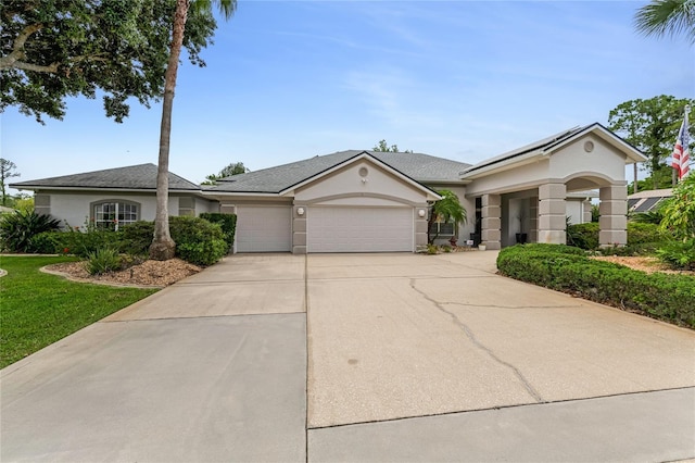 21 Webster Ln, Palm Coast, FL 32164 - ranch-style home with an attached garage, driveway, and stucco siding
