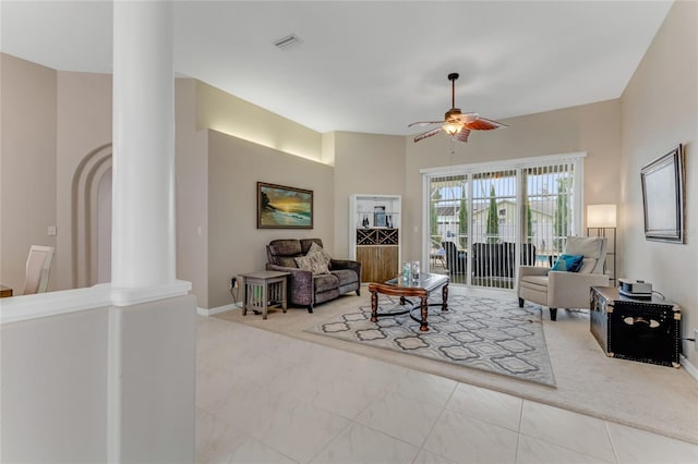 21 Webster Ln, Palm Coast, FL 32164 - living room with decorative columns, a ceiling fan, baseboards, and marble finish floors
