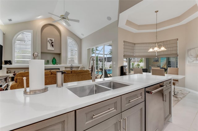 21 Webster Ln, Palm Coast, FL 32164 - kitchen featuring open floor plan, stainless steel dishwasher, a sink, hanging light fixtures, and a chandelier