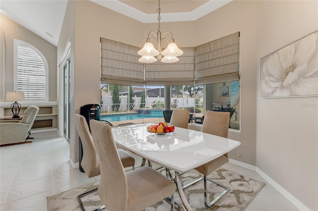 21 Webster Ln, Palm Coast, FL 32164 - dining area with a chandelier, plenty of natural light, baseboards, and light tile patterned flooring