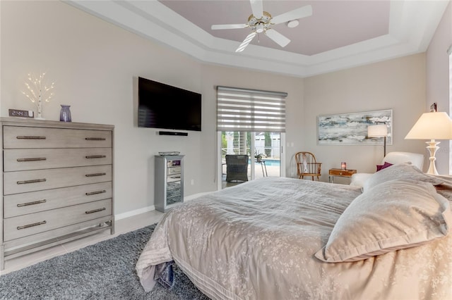 21 Webster Ln, Palm Coast, FL 32164 - bedroom featuring access to outside, a tray ceiling, a ceiling fan, and baseboards
