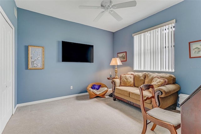 21 Webster Ln, Palm Coast, FL 32164 - carpeted living room with a ceiling fan and baseboards